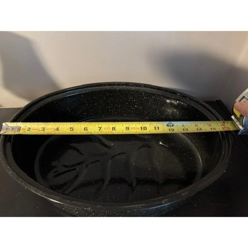 Granite Ware 15-inch oval roaster pan with a lid, speckled black enamel finish.